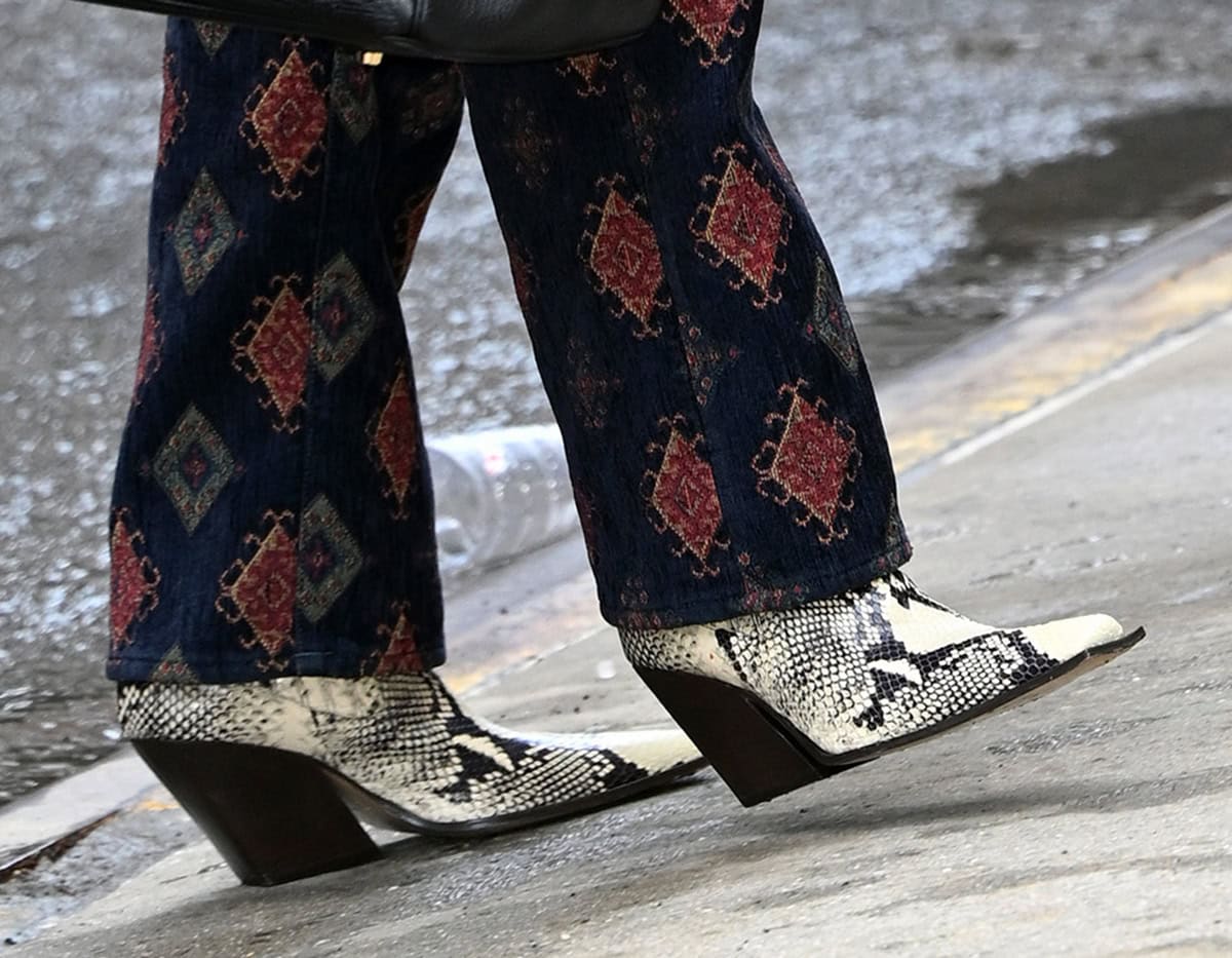 Lisa Rinna embraces prints, slipping into a pair of snakeskin boots with square toes and angular, thick block wedge-like heels