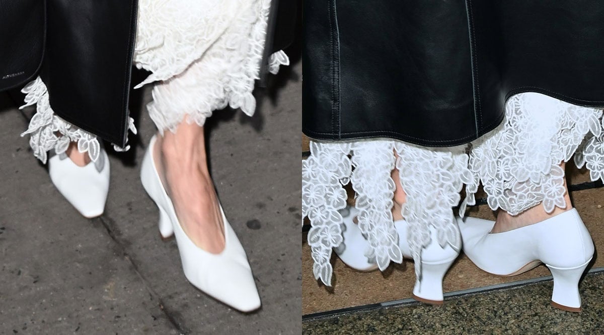 Olivia Munn completes her black-and-white look with white glove pumps, their sculptural flared heels adding a modern edge to the sleek silhouette