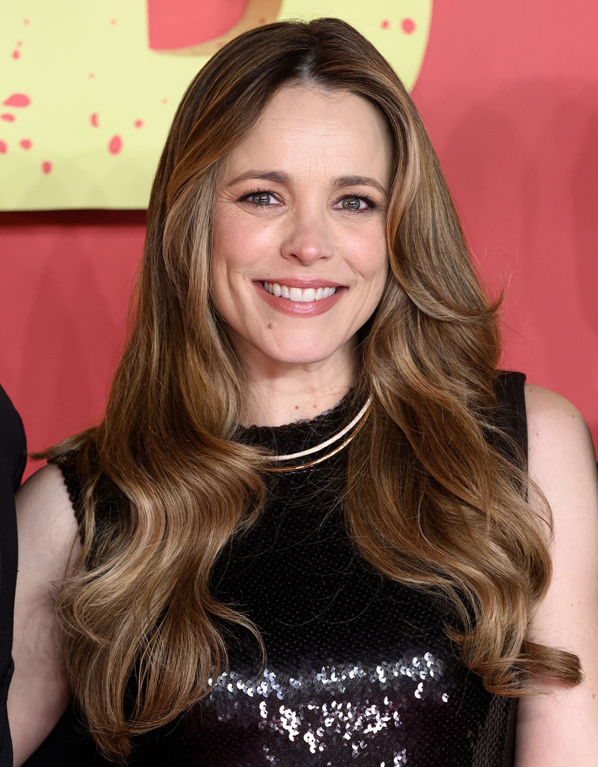 Rachel McAdams styles her already shimmering outfit with Tiffany & Co. necklace, earrings, and rings