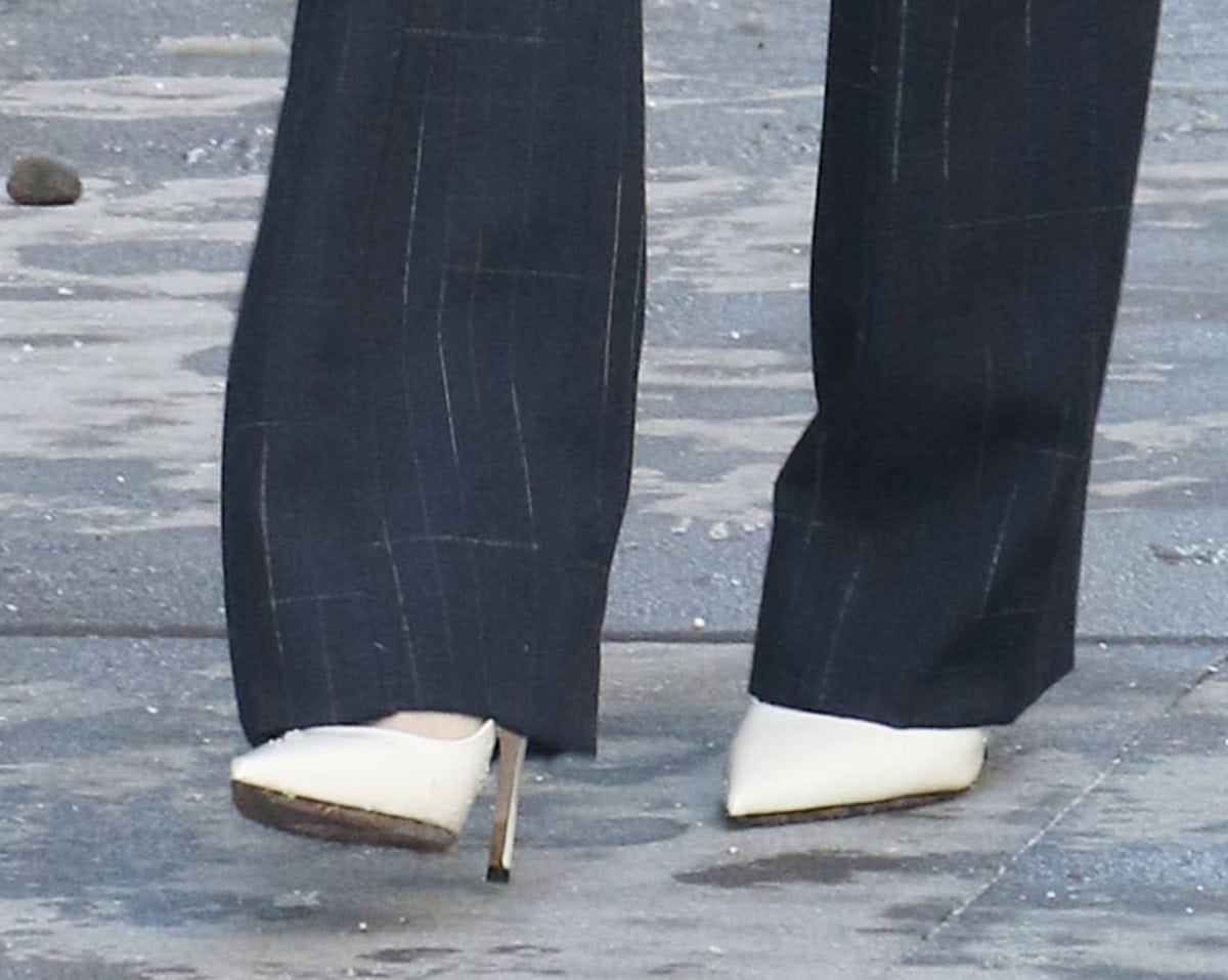 Chloe Kim teams her casual but polished ensemble with white leather slingback pumps