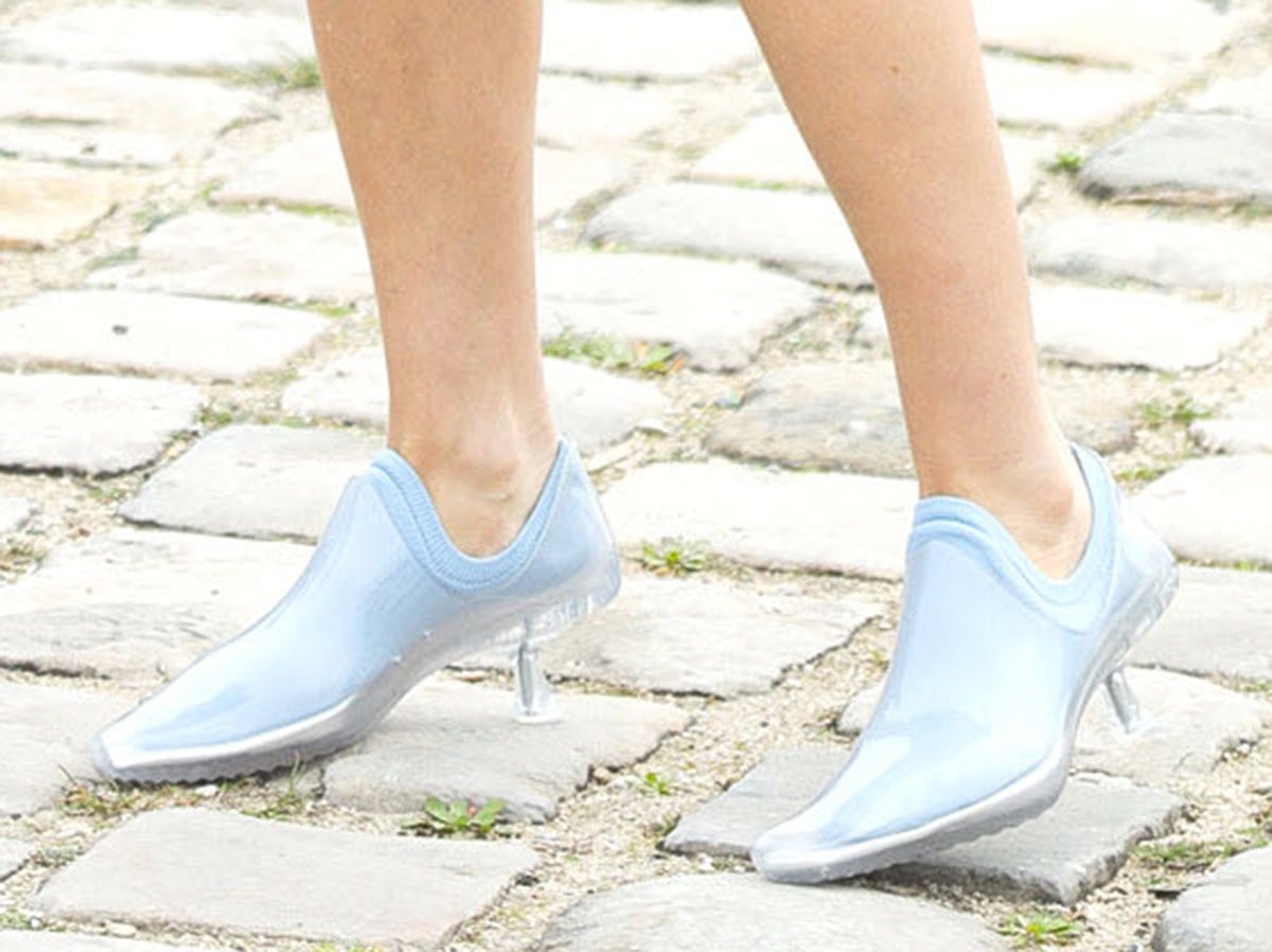 Aubrey Plaza slips into the Loewe “Emily” aqua booties made from see-through PVC with a sculptural, single-piece molded construction
