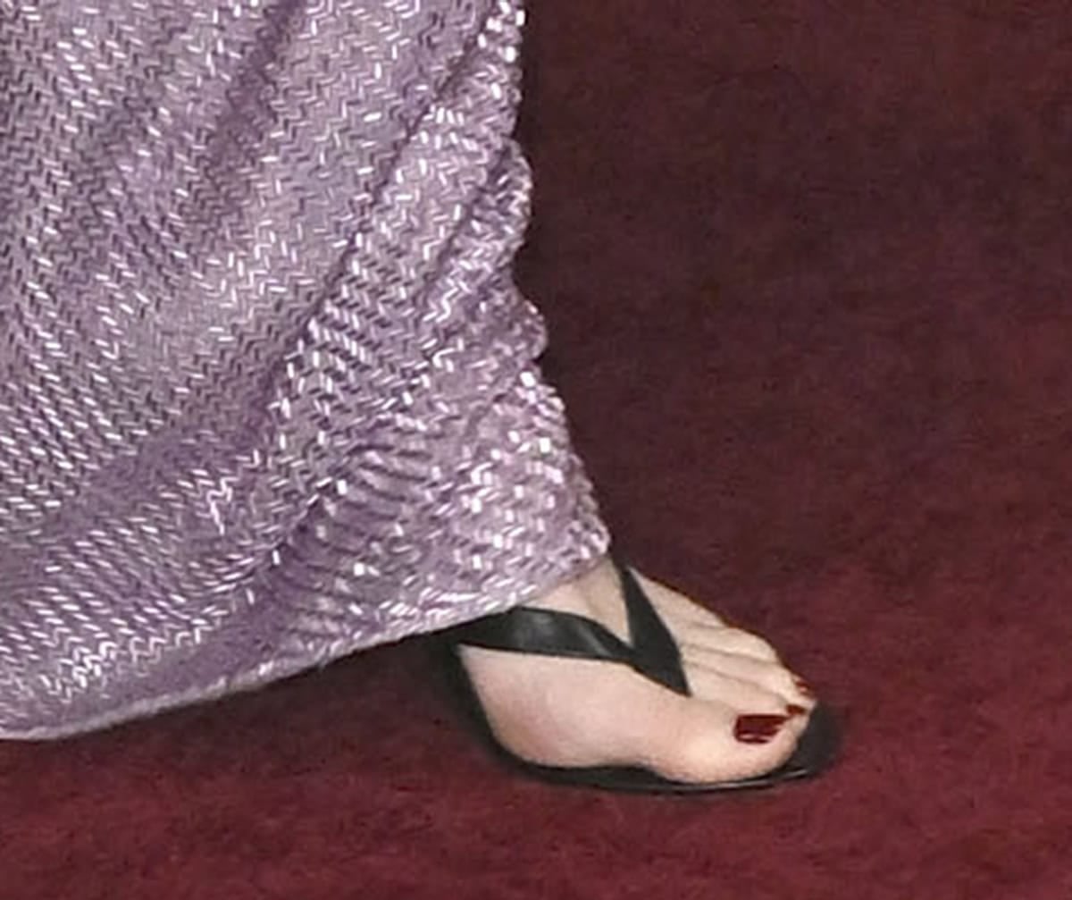 Emma Stone keeps her footwear simple with The Row’s “Sacha” thong sandals