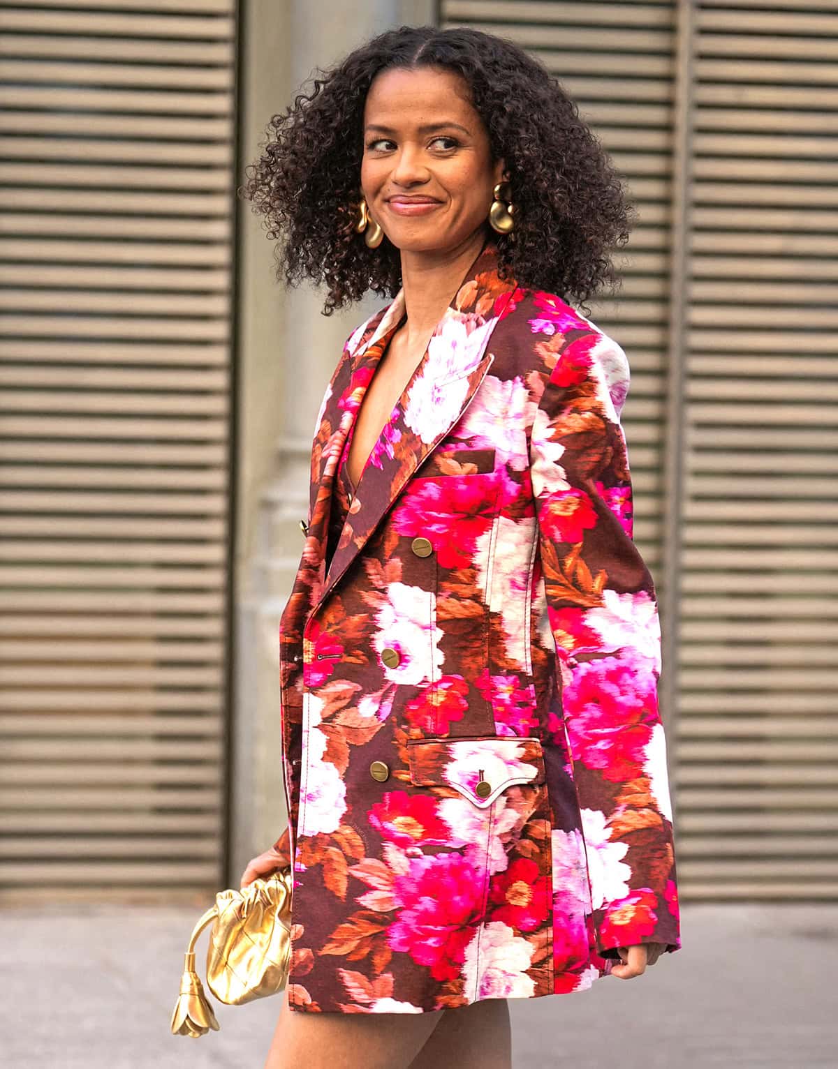Gugu Mbatha-Raw embraces Zimmermann's boho aesthetic, pairing the brown braided platform sandals with a brown-and-pink floral short suit set