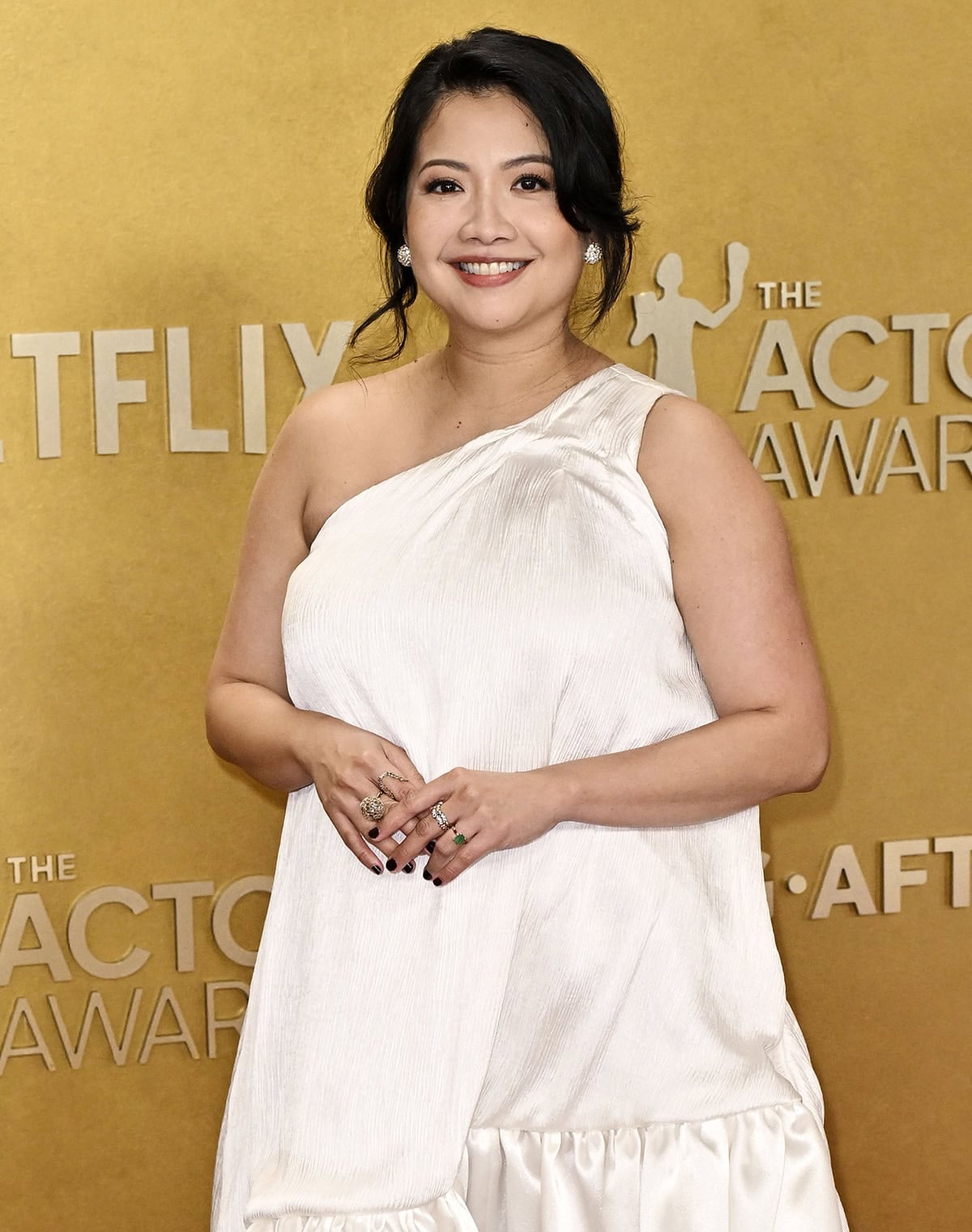 Kristin Villanueva teams her wedding-ready shoes with a white one-shoulder dress by Ouma Couture Atelier