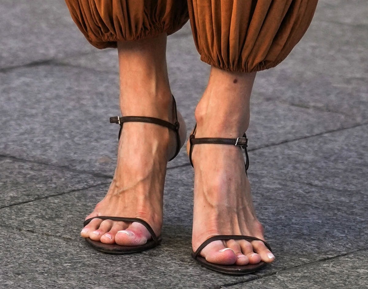 Leonie Hanne kept her footwear simple with a pair of brown open-toe sandals by Christen, enhancing the boho vibe of her look