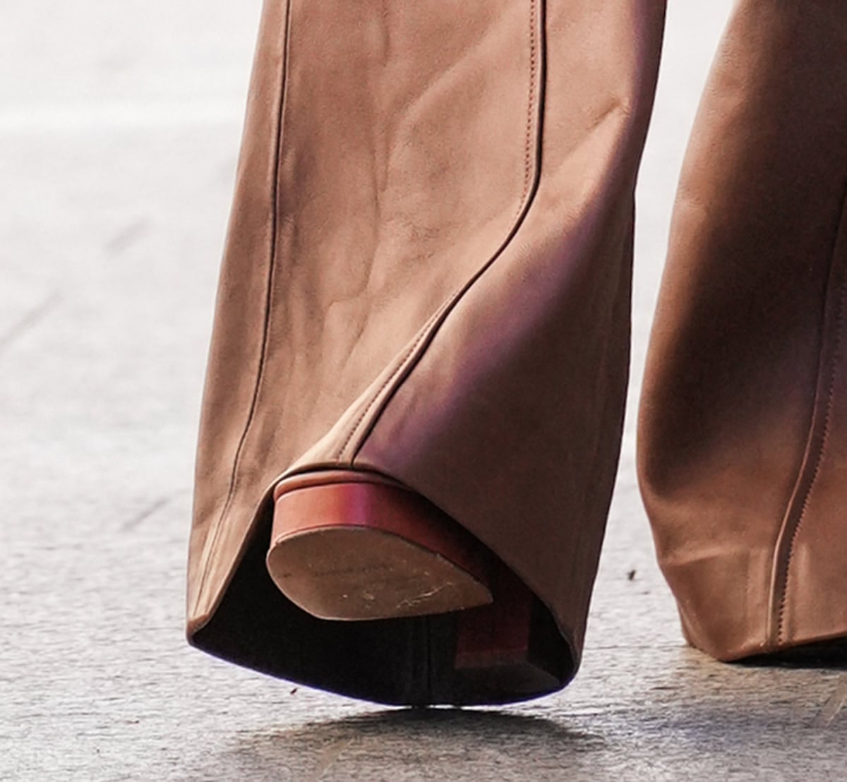 Lily James wears the same Zimmermann shoes as Naomi Watts, with platforms, braided straps, and block heels