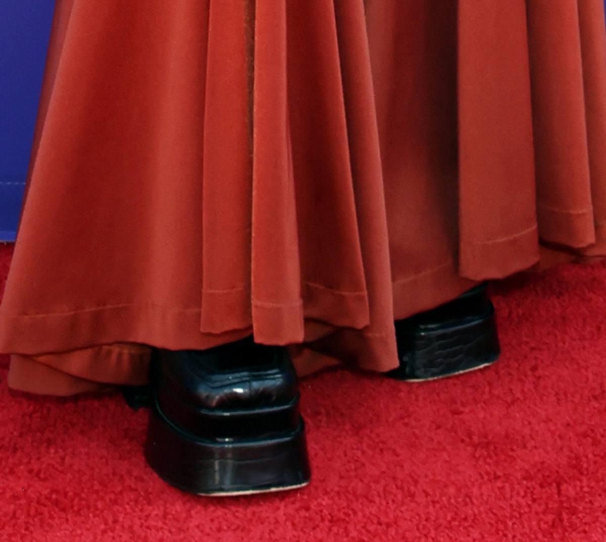 Mel B adds a bold, fierce energy to the red carpet in a pair of black croc-embossed boots with triple platforms