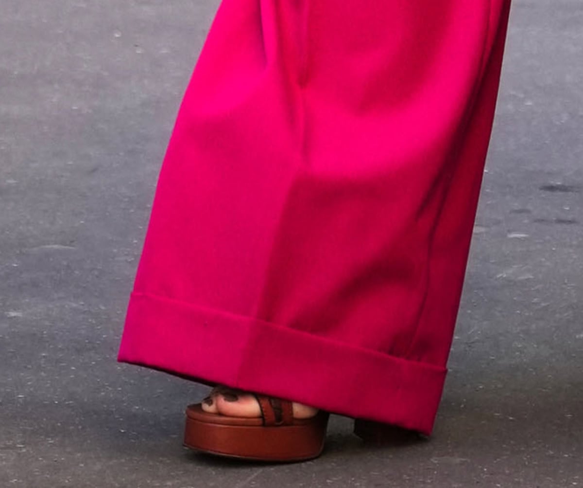 Naomi Watts slips into the Zimmermann “Alchemy” platform sandals in rich Siena calf leather featuring braided straps, a buckled slingback strap, platforms, and towering block heels