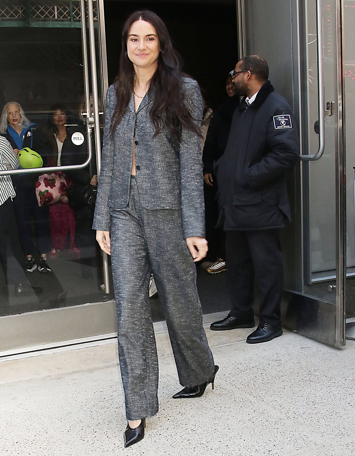 Shailene Woodley pairs her slingback pumps with a gray Kallmeyer jacket and matching wide-leg trousers