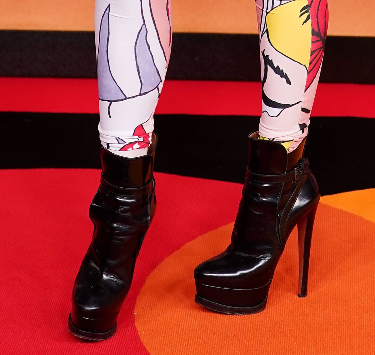 Tallia Storm goes edgy in black Alaia platform ankle boots with an ankle strap and tall heels