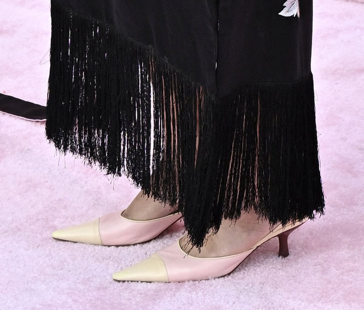 Bella Murphy adds color to her black look with vintage Chanel slingback pumps in beige and pink with wooden kitten heels