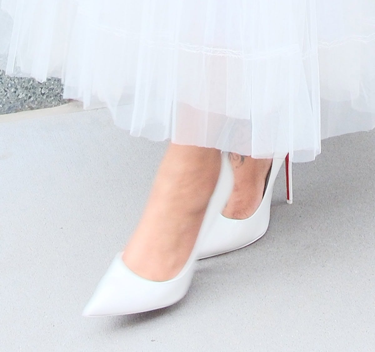 Brandy slips into the classic-favorite Christian Louboutin “So Kate” pumps featuring a low-cut design, pointed toes, and stiletto heels