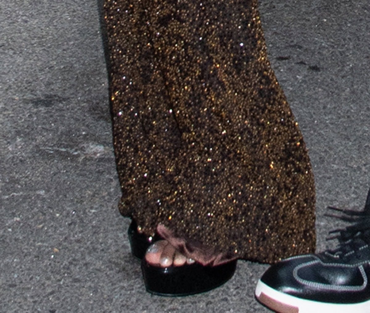 Gabrielle Union adds height to her frame with the Aldo “Nissa” platform sandals in super shiny black patent leather