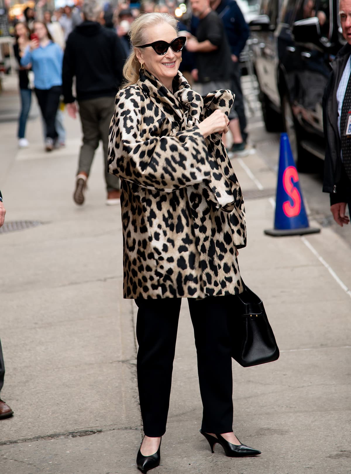 Meryl Streep drops by The Late Show with Stephen Colbert in a cheetah-print Givenchy coat, pants, and Gianvito Rossi slingback pumps to discuss The Devil Wears Prada sequel