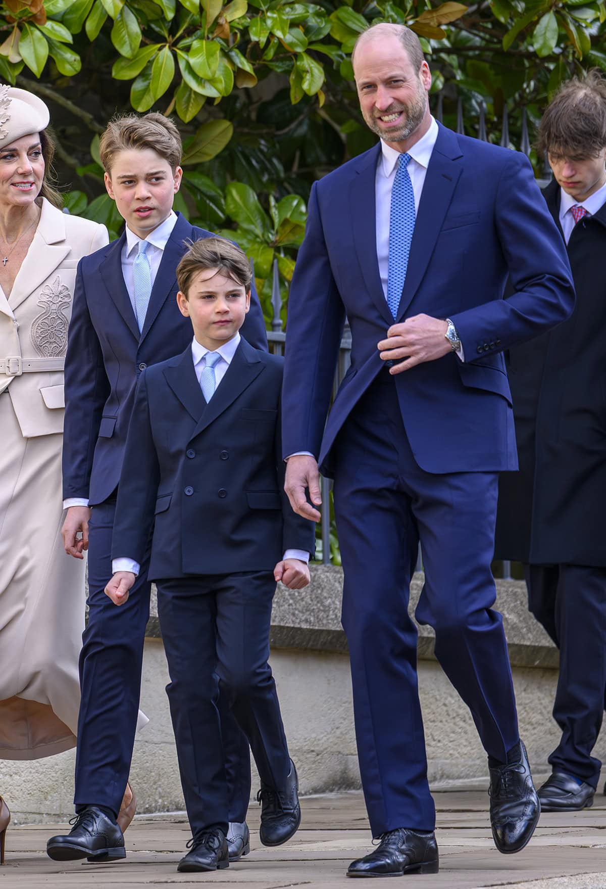 Prince William, Prince George, and Prince Louis coordinate in navy suits with black Oxford shoes