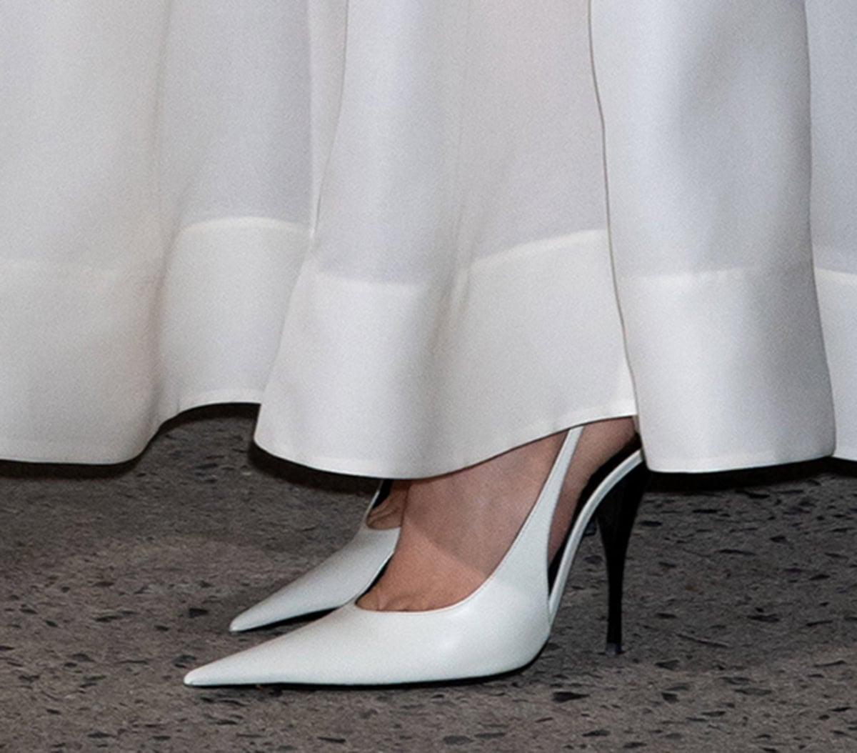 Rosé keeps it sleek in Saint Laurent P.A.R.I.S. slingback pumps featuring elongated pointed toes and lacquered metal stiletto heels