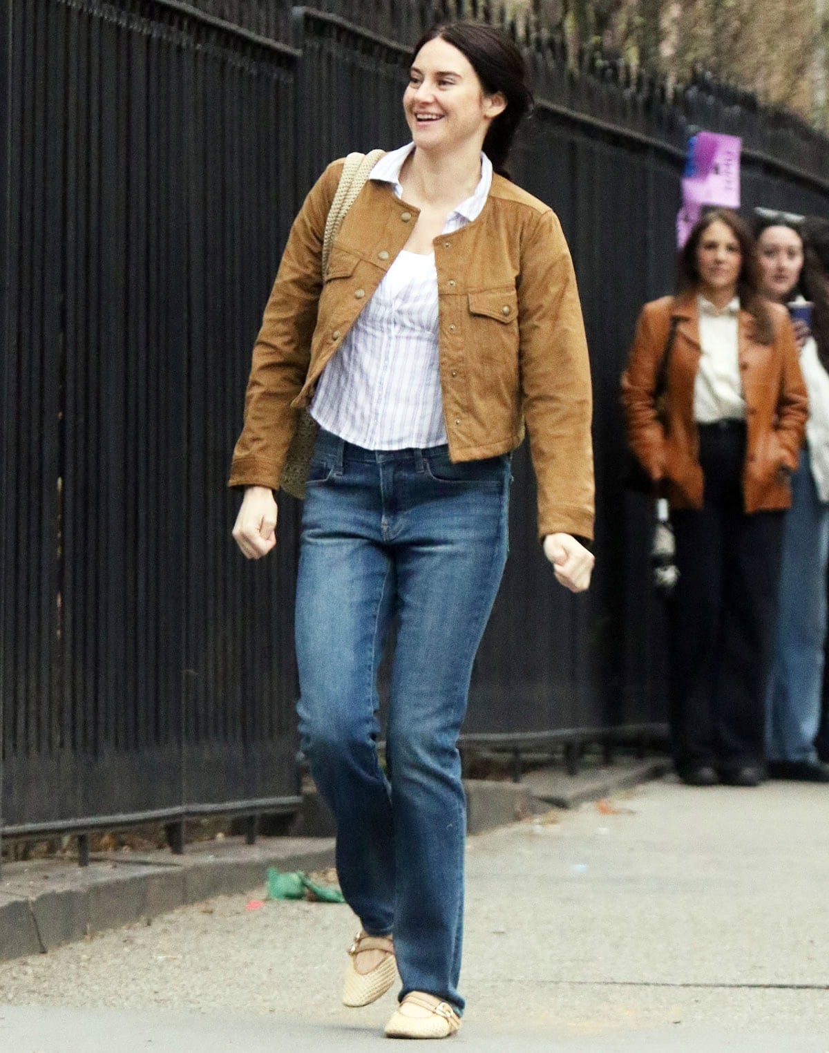 Shailene Woodley teams her summery Mary Jane flats with mid-wash straight-leg jeans, a striped shirt, and a brown suede jacket