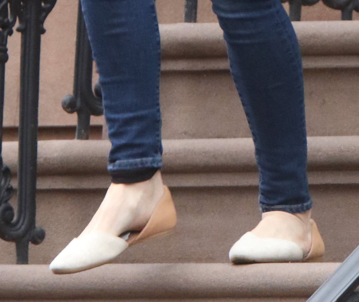 Shailene Woodley is also seen on the set wearing a pair of Toms “Gemma” D’Orsay flats in two-tone nude and tan textile and leather