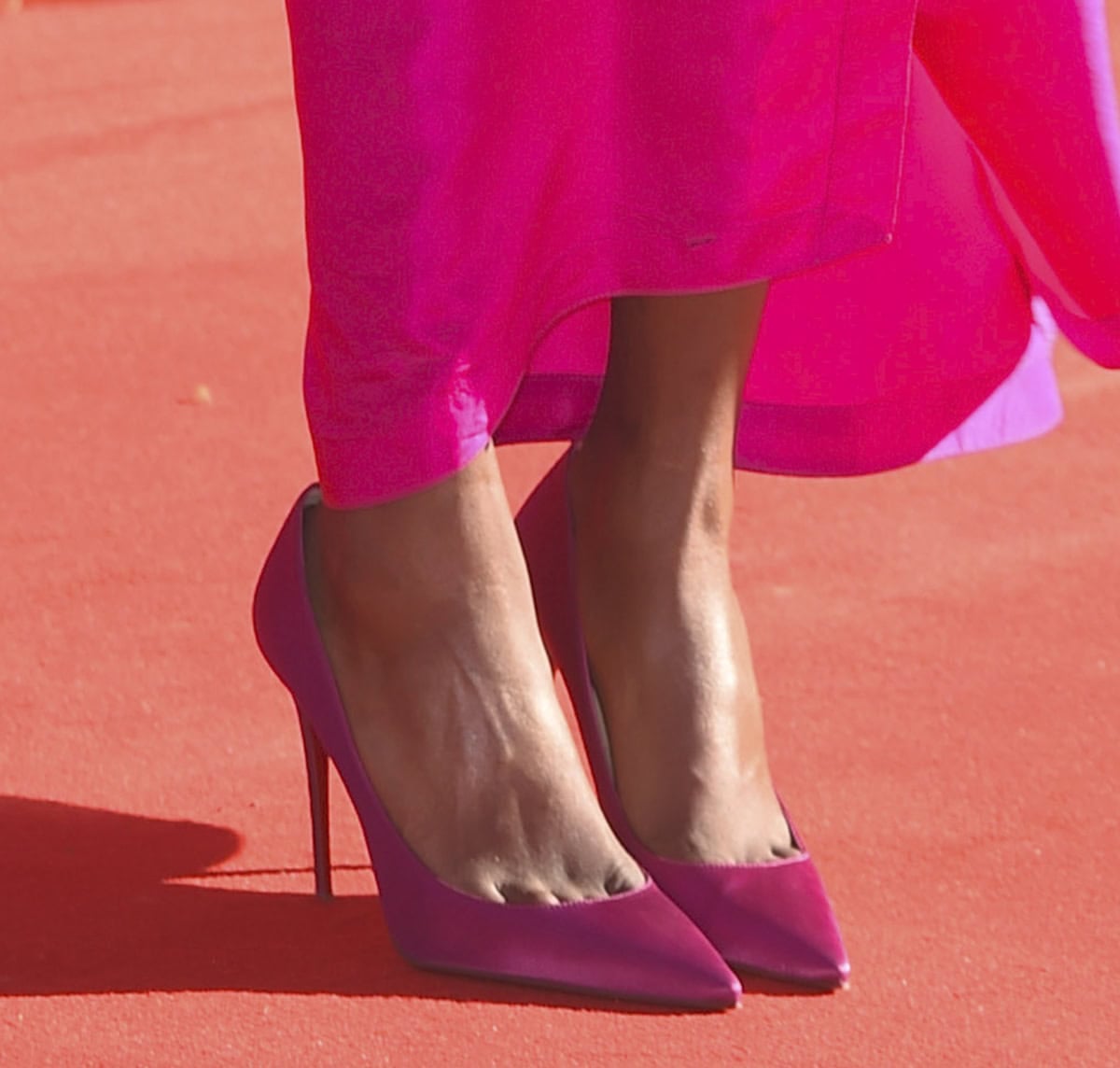 Simone Ashley goes the pink route, wearing the Christian Louboutin “So Kate” pumps in a striking pink shade