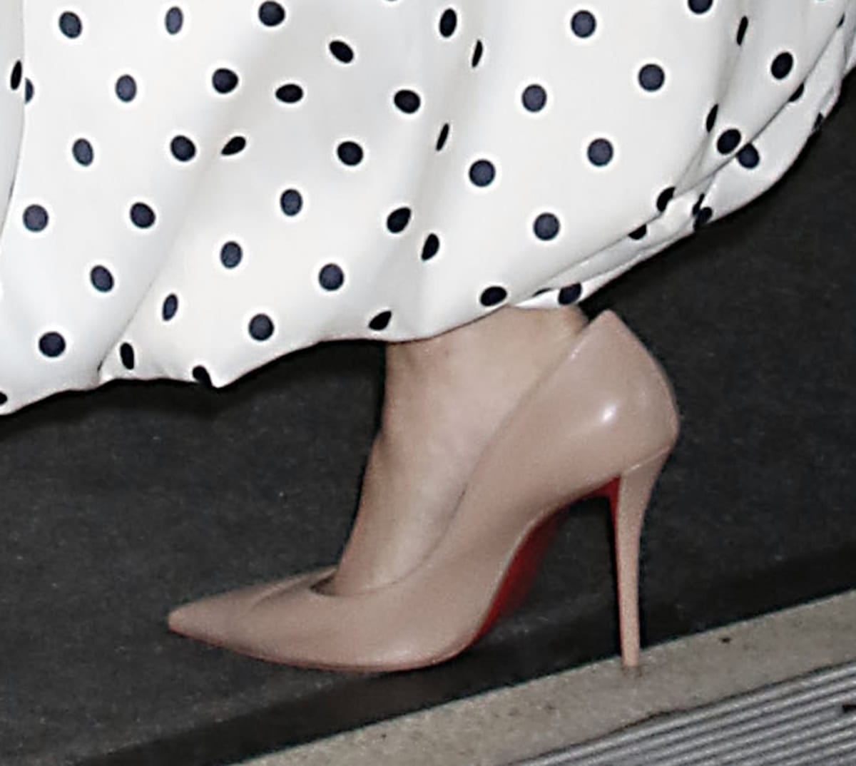 Storm Reid refines her look with nude Christian Louboutin “Miss Z” pumps, the sleek pointed toe and slim stiletto adding length and polish beneath her voluminous polka-dot skirt