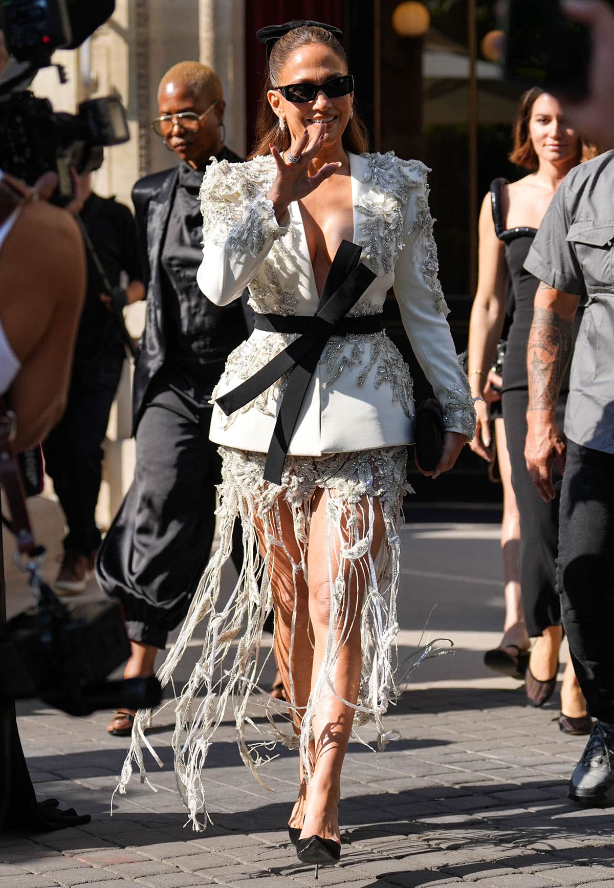 Jennifer Lopez graces the Zuhair Murad Haute Couture Fall/Winter 2026-2027 front row during Paris Fashion Week, wearing a crystal-embellished jacket and skirt from the Lebanese designer and black pumps from Dolce & Gabbana